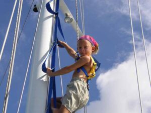 Quincy up the mast watching for reefs | Cabrito | Marinalife